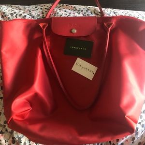 Red lepilage longchamp medium bag.